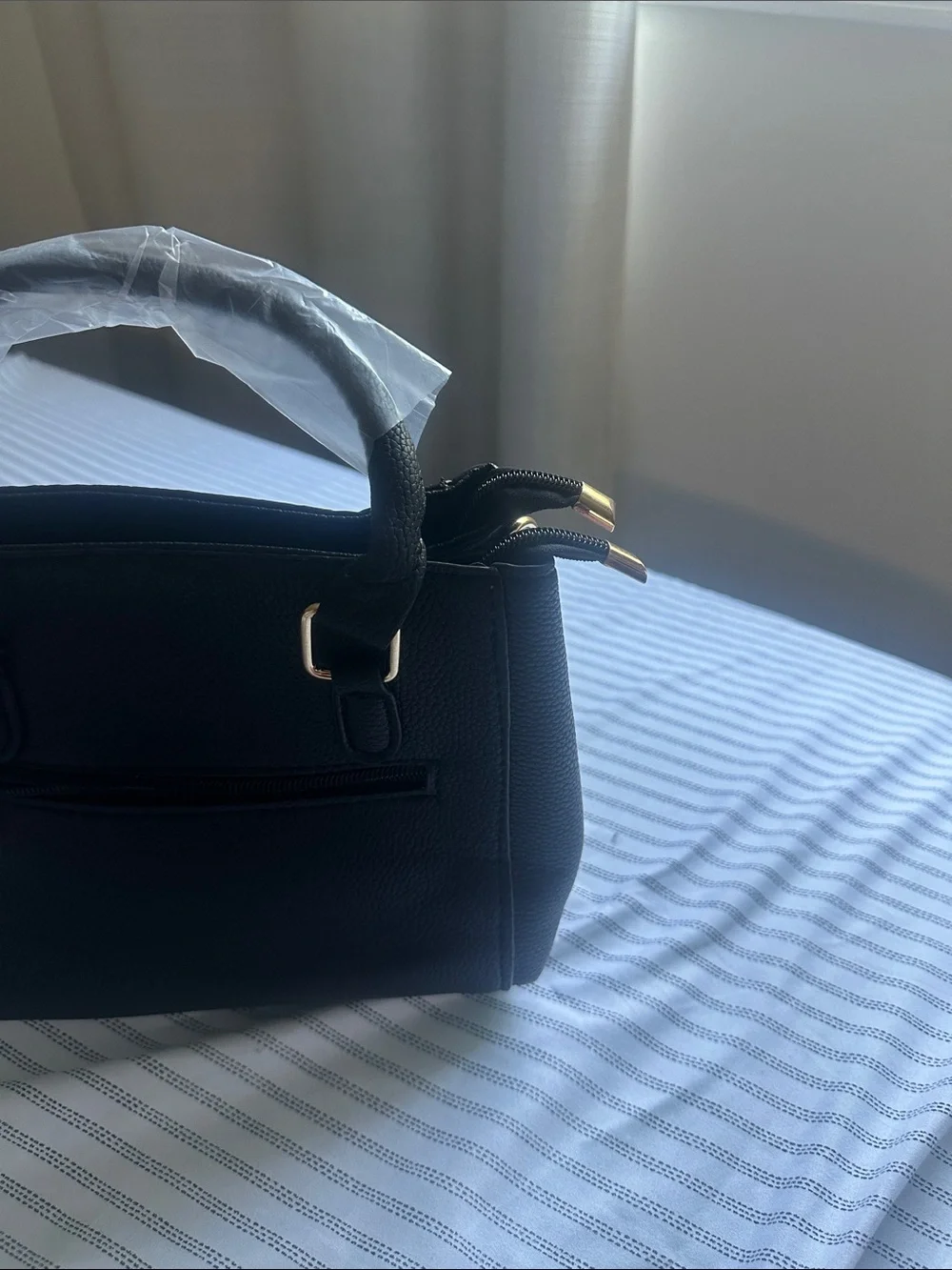 Black structure Macy’s brand full Leather hand back